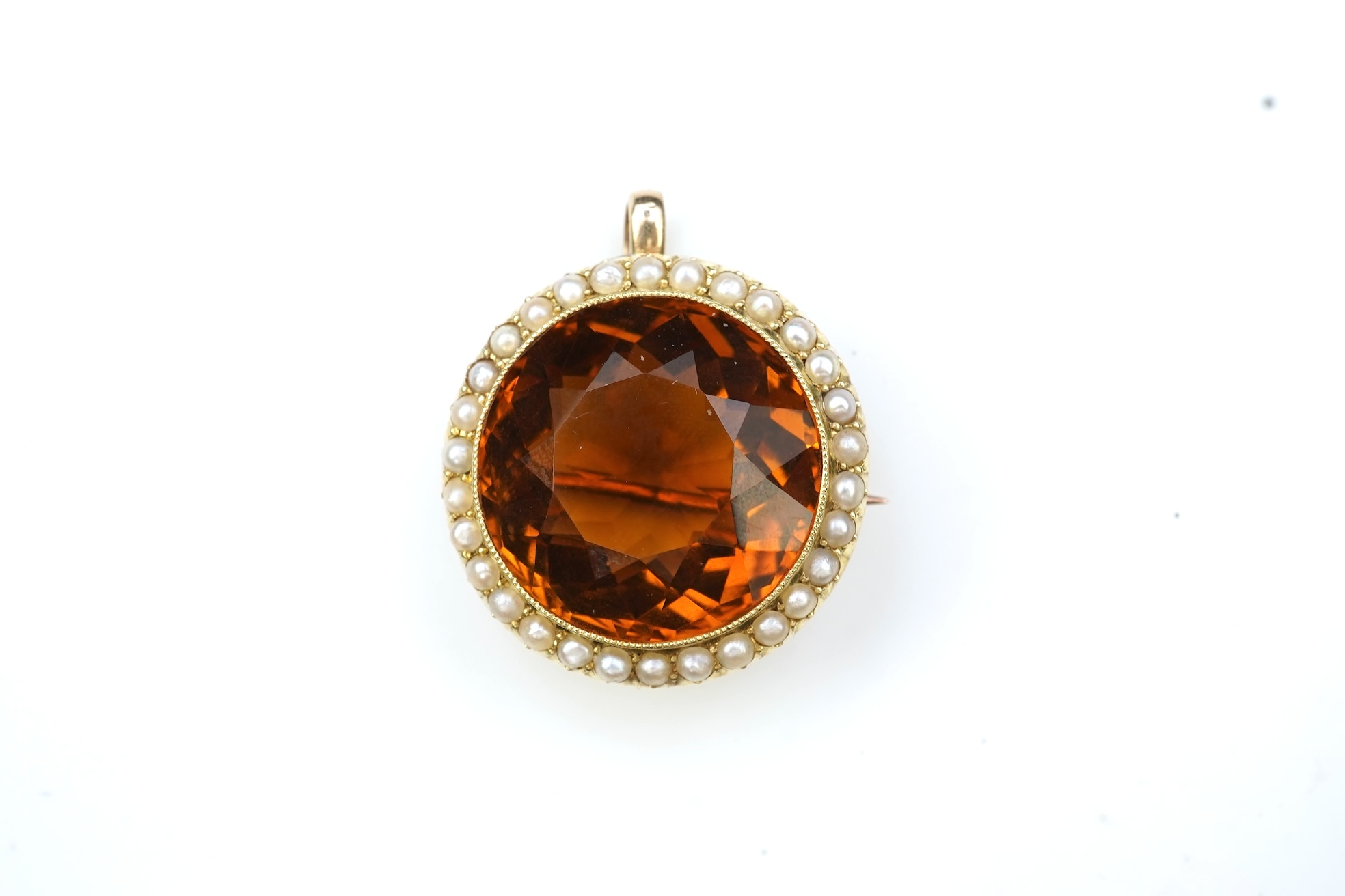 An Edwardian citrine and pearl brooch/pendant, early 20th century